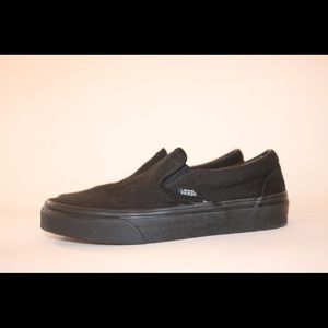 All black slip on vans